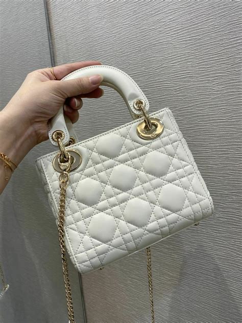 mini dior white bag.